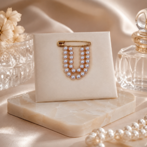 Rose pink pearl brooch featuring elegant floral detailing for sarees, dresses, jackets, and special occasions.