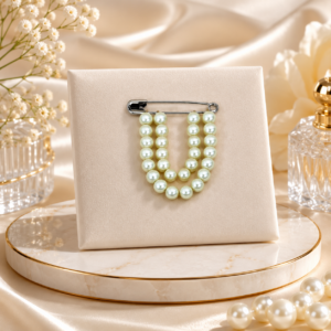 Elegant cream pearl brooch with floral design, suitable for sarees, dresses, blazers, and party wear accessories.