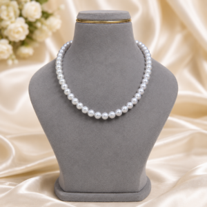 Steel grey pearl necklace with glossy round pearls arranged in a classic single-strand design for women.