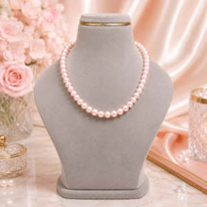 Rose pink pearl necklace with smooth glossy pearls in a stylish single-strand design for women.