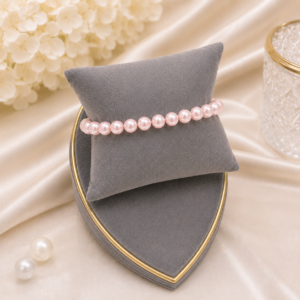 Rose pink pearl bracelet featuring glossy blush pink pearls in an elegant stretch bracelet design.