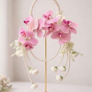 Blush orchid pearl halo display with cascading strands on gold stand