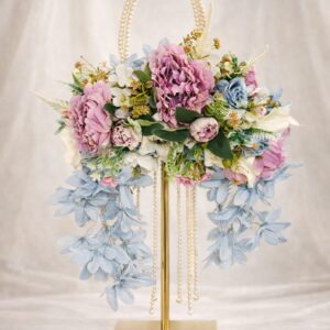 Pastel floral pearl cascade bouquet with blue and pink blooms