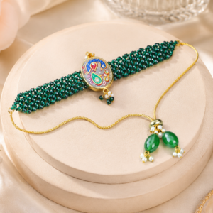 Handmade green beaded designer rakhi featuring colorful paisley artwork, kundan stones and traditional handcrafted detailing.